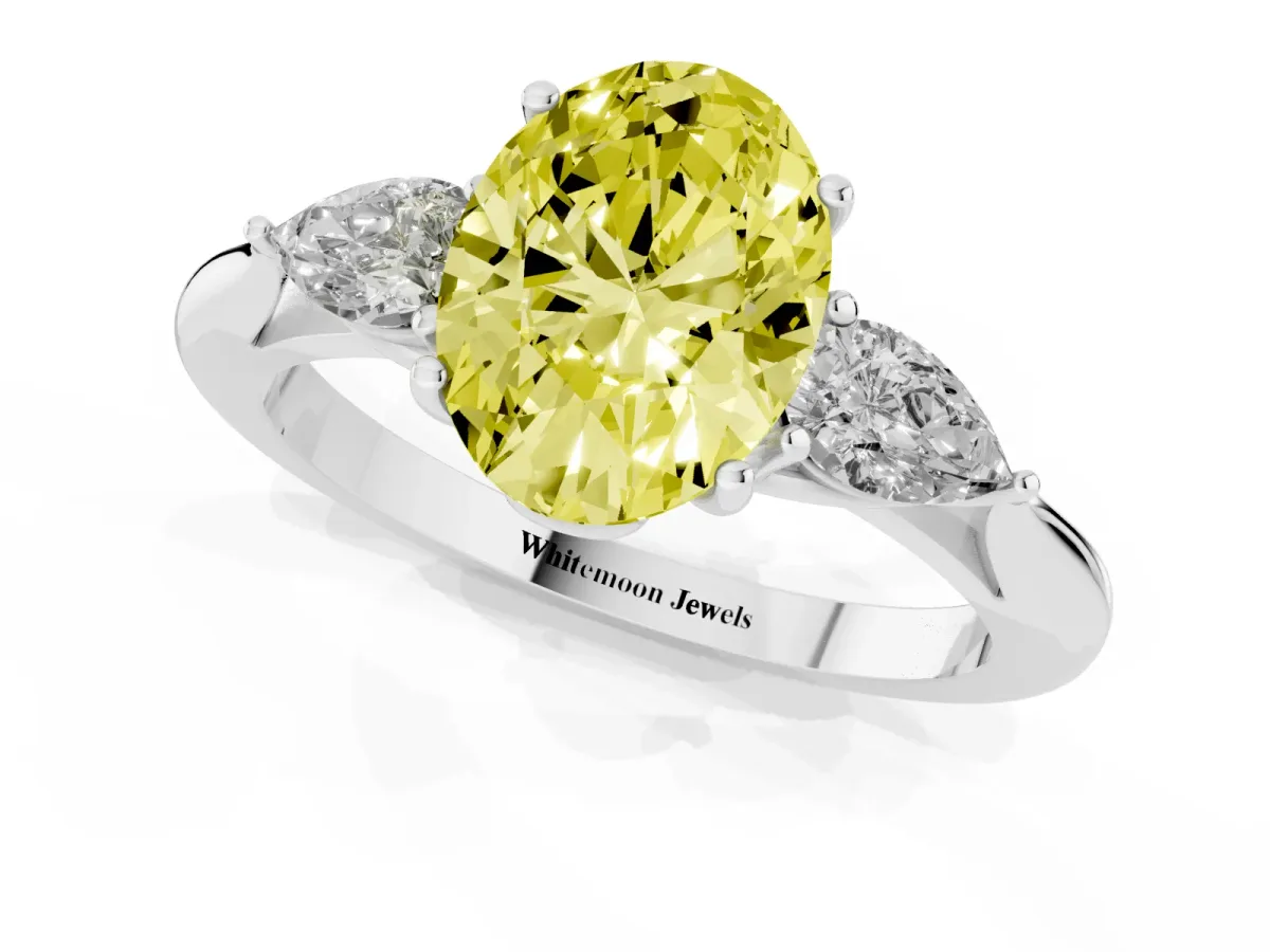 Fancy Yellow Three-Stone Oval Cut Diamond Ring with Pear Side Stones in Four-Prong Setting Silver