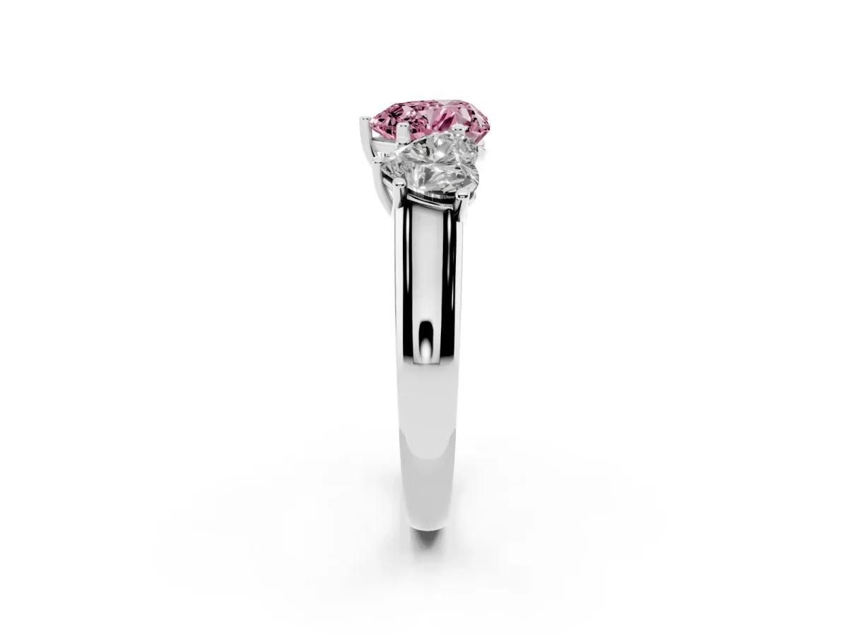 Fancy Pink Heart Cut Three-Stone Diamond Ring with Prong Setting on a Classic Band Silver
