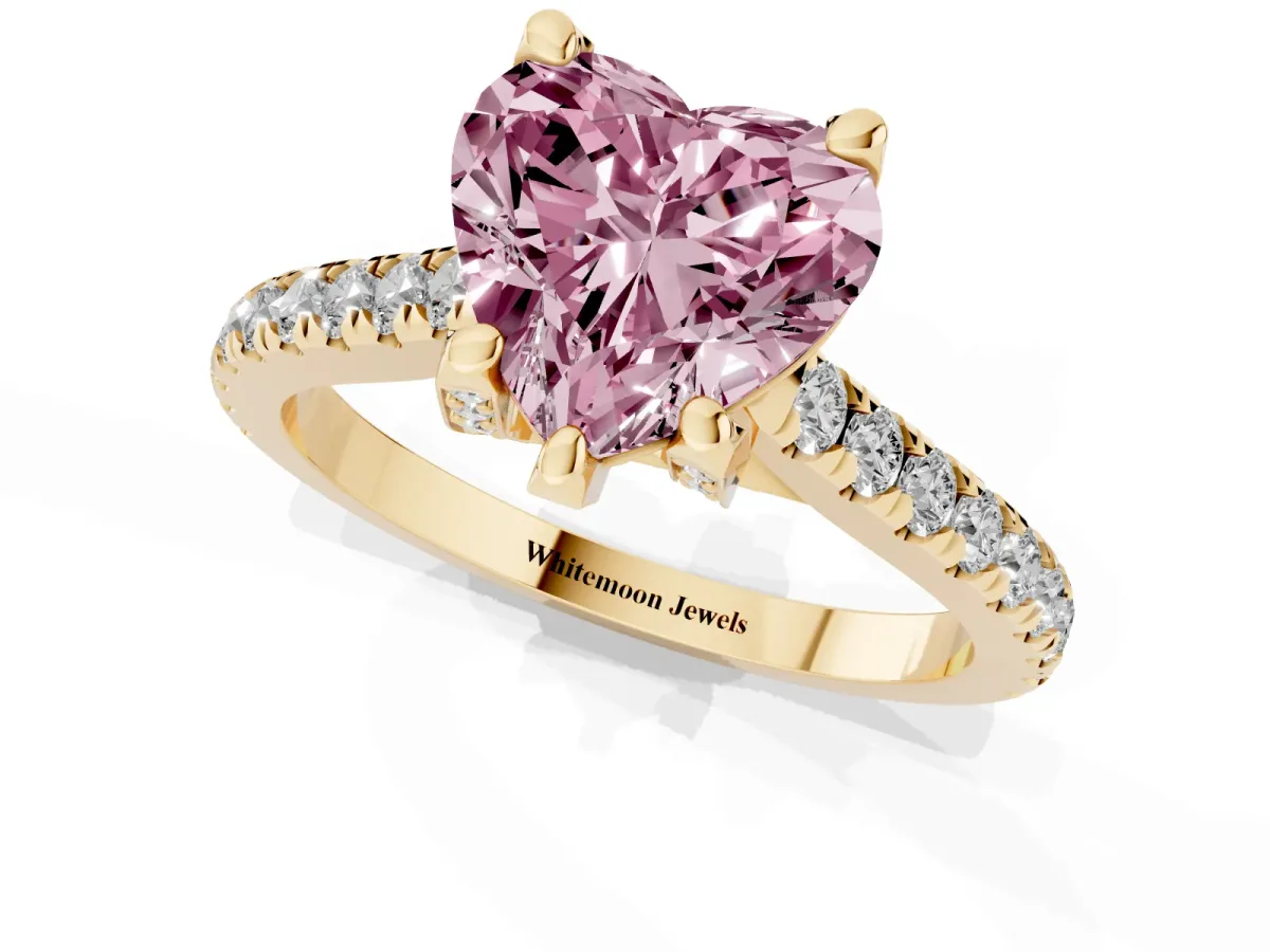 Fancy Pink Heart Cut Brilliant Diamond Solitaire with Pavé Band and Four-Prong Setting Yellow gold