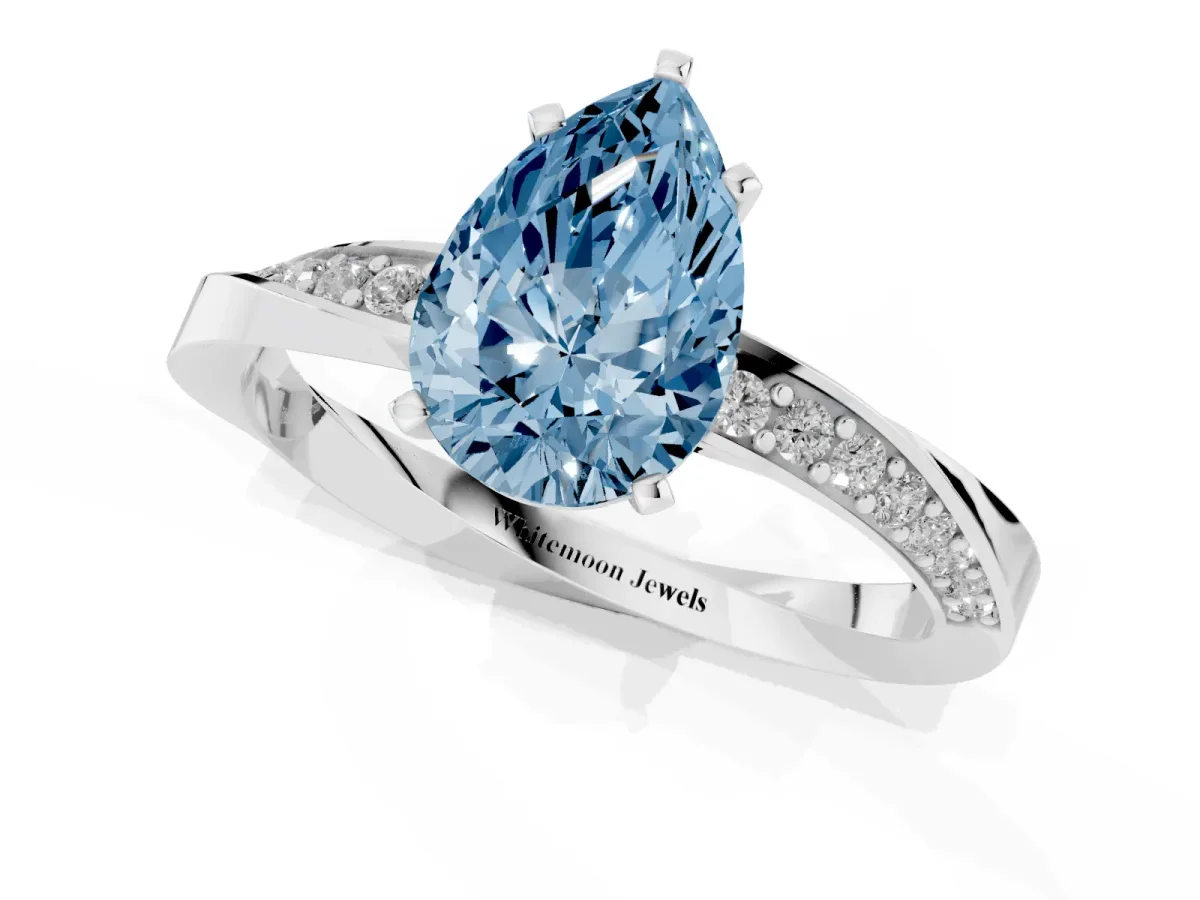 Fancy Blue Pear Cut Diamond Engagement Ring with Side Stone Accents and Four-Prong Setting Silver