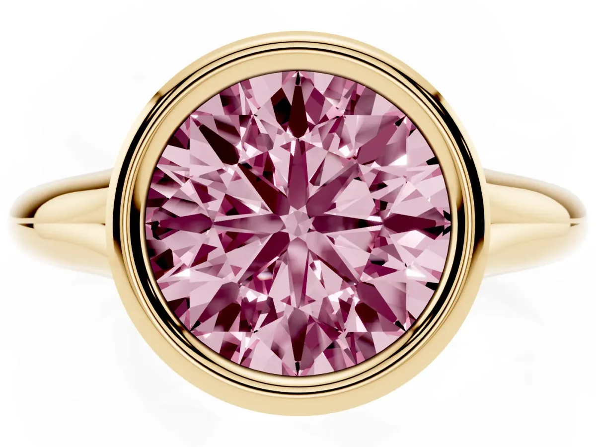 Fancy Pink Bezel Set Round Cut Solitaire Diamond Ring with Smooth Band Yellow gold