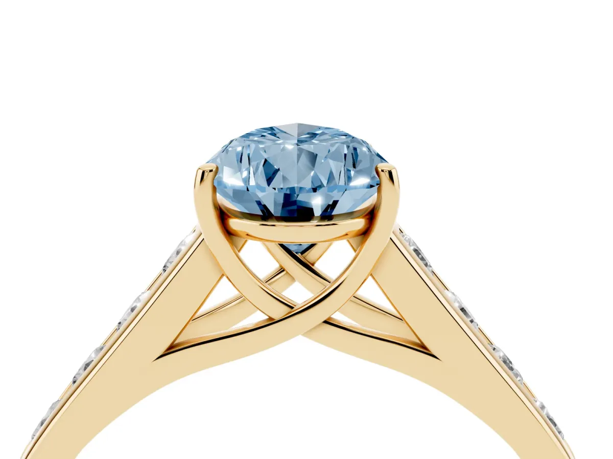 Fancy Blue Pear Cut Brilliant Channel-Set Solitaire Ring with Four-Prong Setting Yellow gold