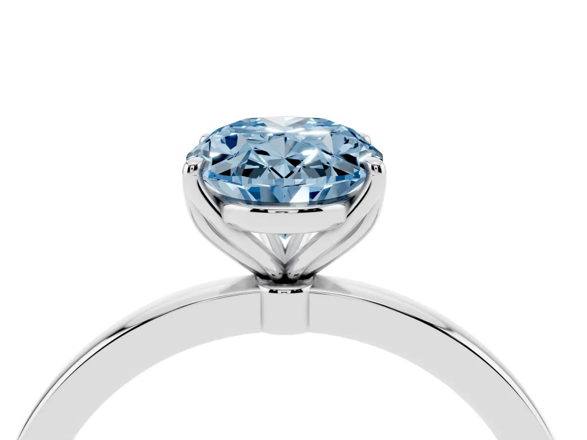 Fancy Blue Oval Cut Diamond Solitaire Ring with Thin Band and Prong Setting Silver