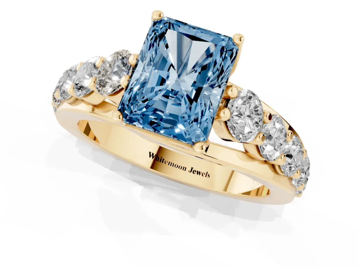Fancy Blue Radiant Cut Diamond Engagement Ring with Pavé Band and Four-Prong Setting Yellow gold