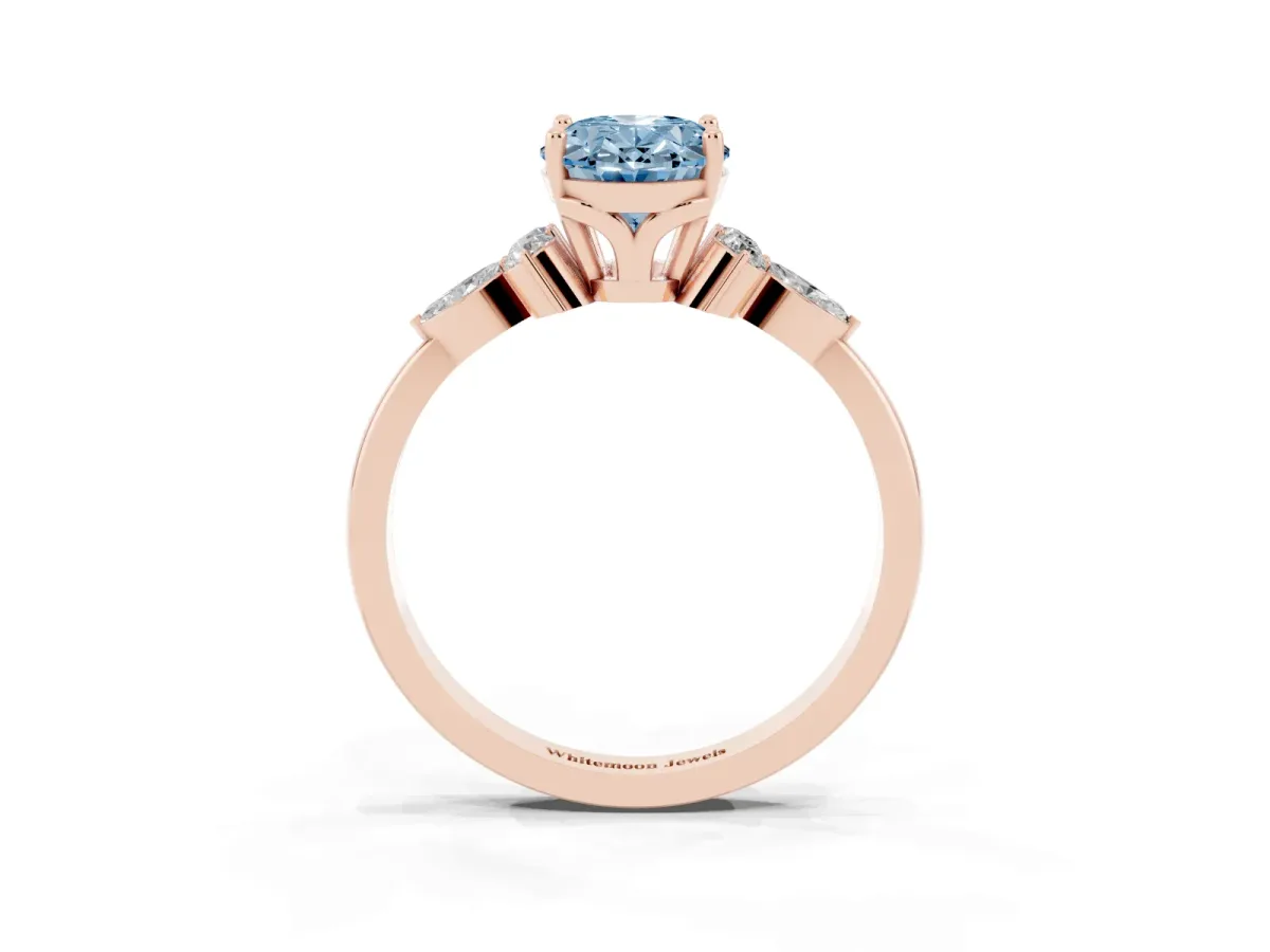 Fancy Blue Oval Cut Brilliant Diamond Solitaire Ring with Pear Side Stones and Four-Prong Setting Rose gold