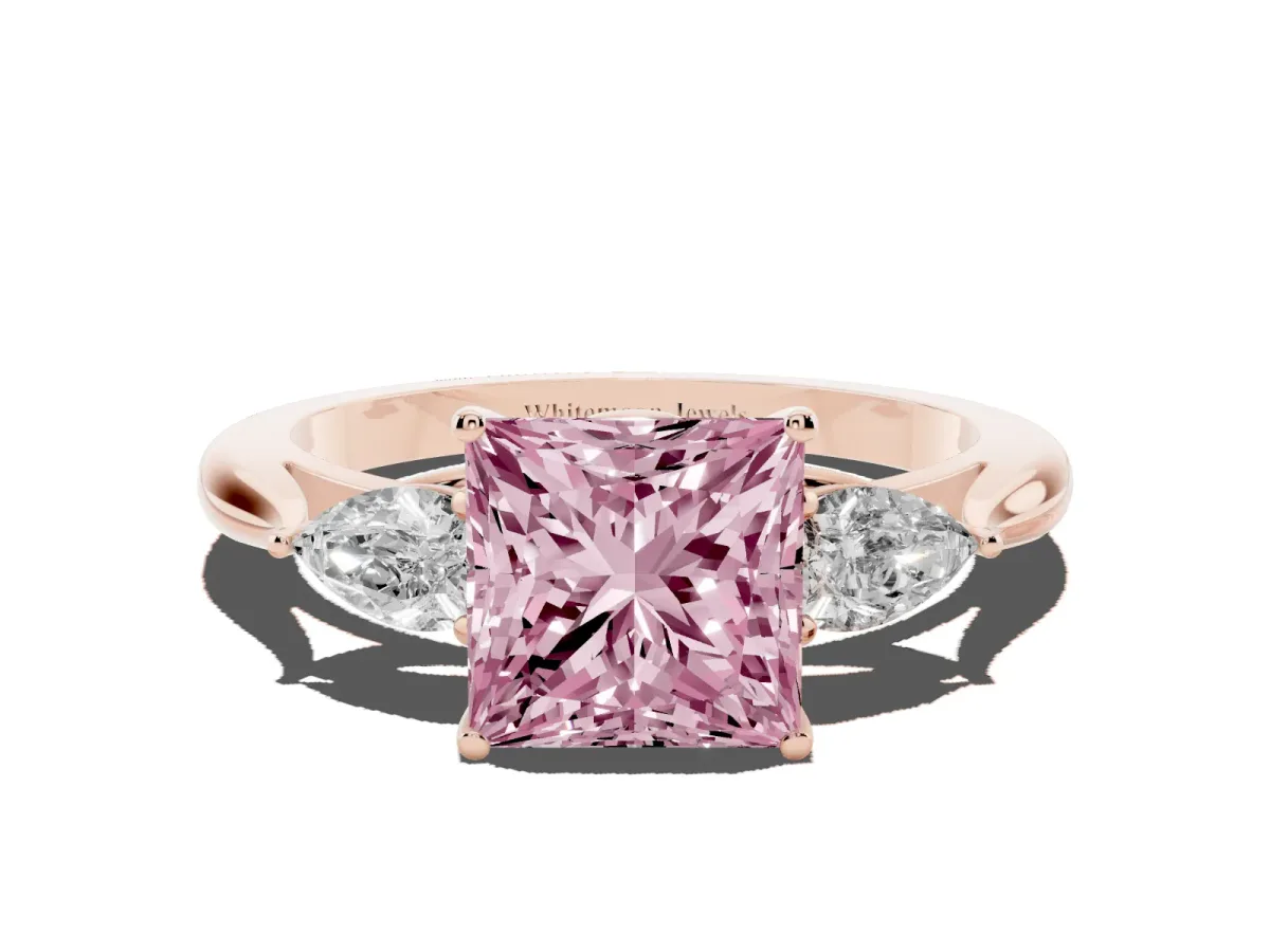 Fancy Pink Three-Stone Princess Cut Diamond Ring with Pear Side Stones in Four-Prong Setting Rose gold