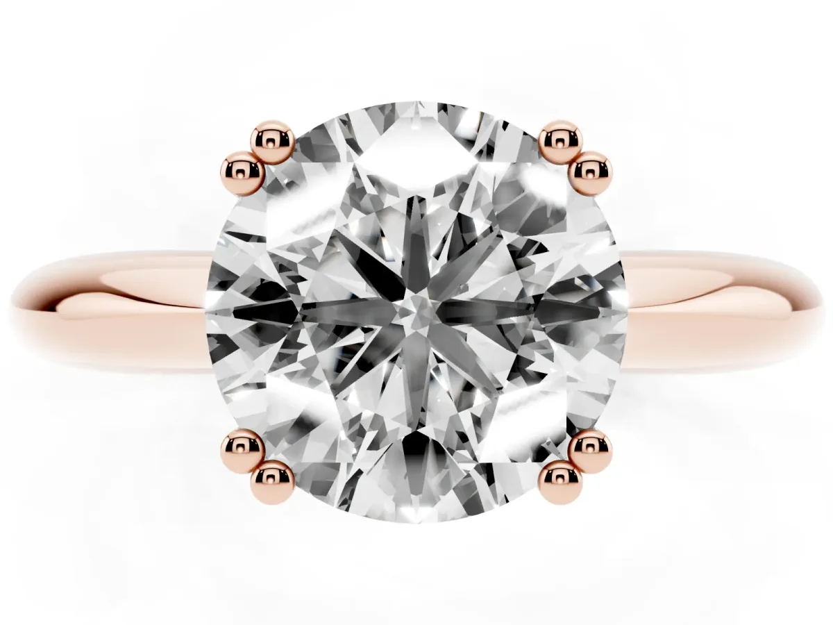 Round Cut Cut Solitaire Engagement Ring with Tapered Band and Four-Prong Setting Rose gold