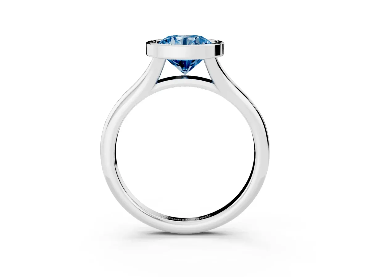 Fancy Blue Bezel Set Round Cut Solitaire Diamond Ring with Smooth Band Silver