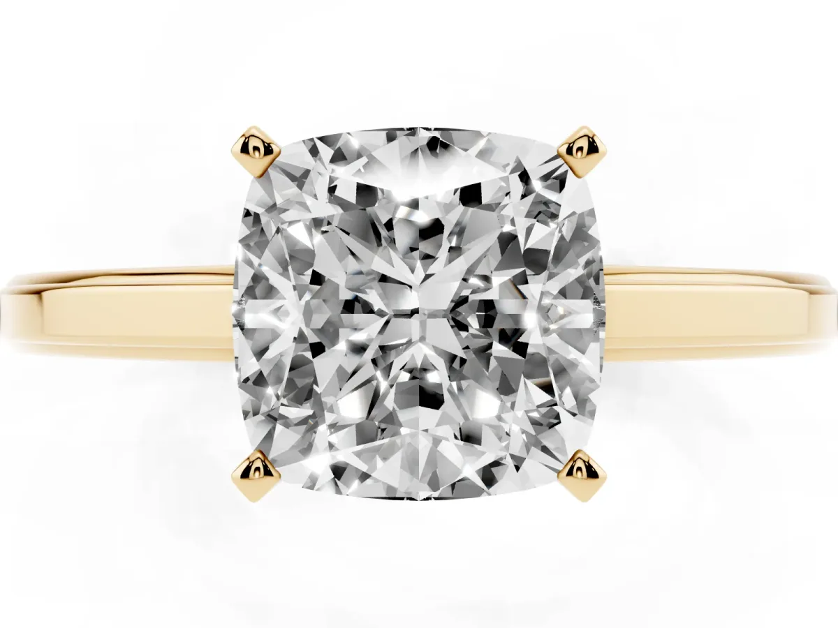 Cushion Cut Solitaire Diamond Ring with Four-Prong Setting and Classic Band Yellow gold