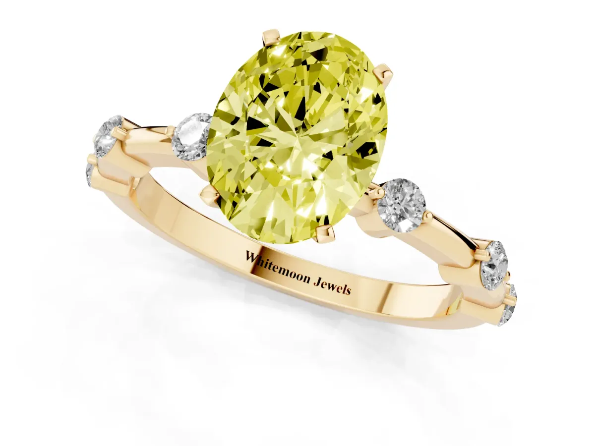 Fancy Yellow Oval Cut Solitaire Diamond Ring with Bezel Set Side Stones and Prong Setting Yellow gold