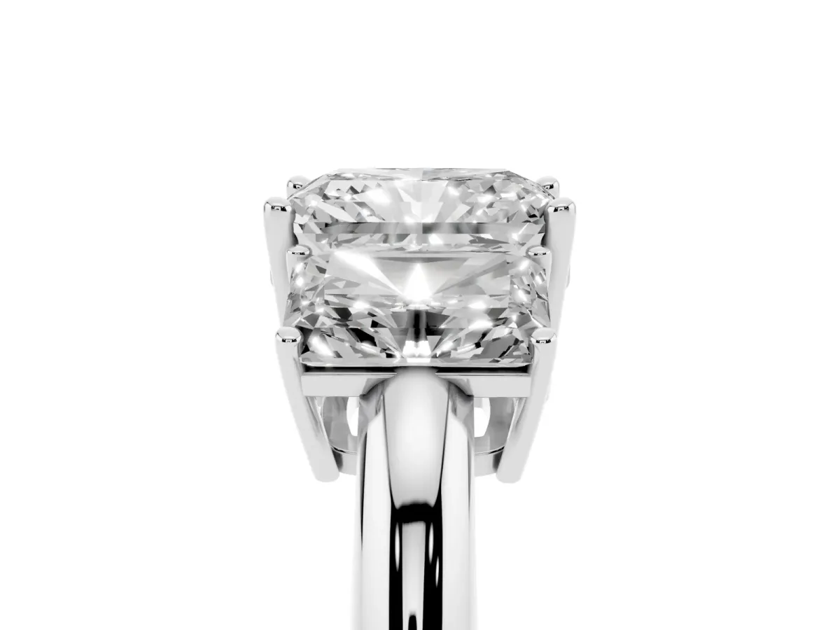 Three-Stone Radiant Cut Cut Diamond Engagement Ring with Prong Setting on a White Gold Band Platinum