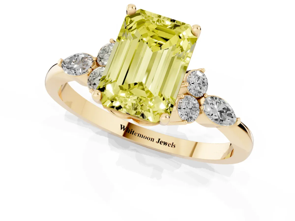 Fancy Yellow Emerald Cut Brilliant Diamond Solitaire Ring with Pear Side Stones and Four-Prong Setting Yellow gold