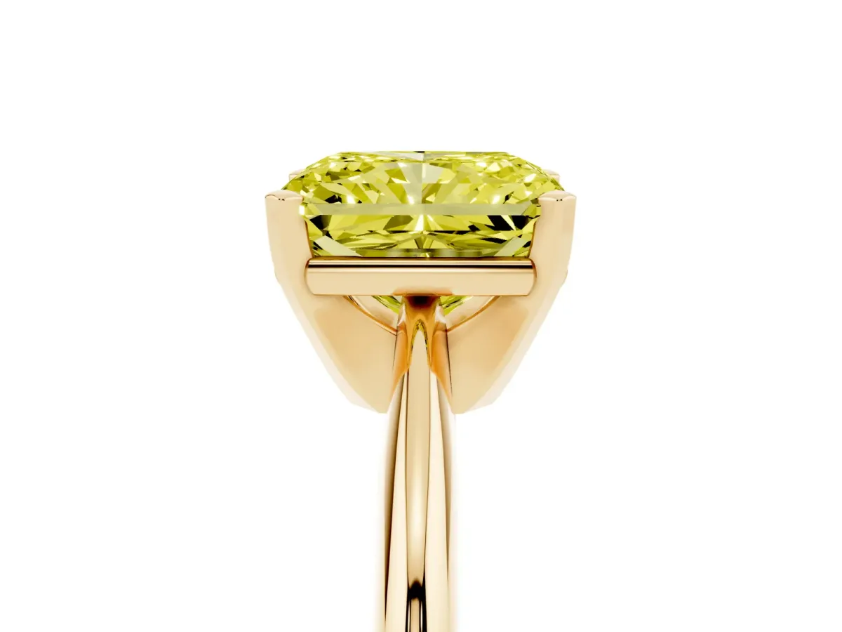Fancy Yellow Radiant Cut Cut Solitaire Ring with Four-Prong Setting on a Classic Band Yellow gold