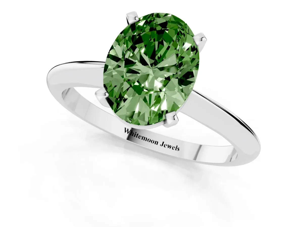 Fancy Green Oval Cut Cut Solitaire Ring with Four-Prong Setting on a Classic Band White gold