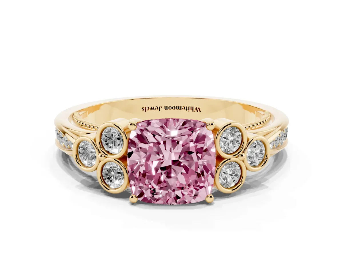 Fancy Pink Cushion Cut Cut Diamond Engagement Ring with Bezel Set Round Side Stones and Prong Setting Yellow gold