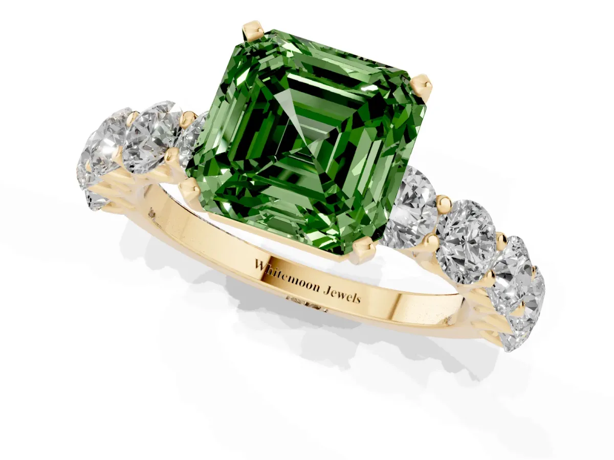 Fancy Green Asscher Cut Diamond Prong Setting with Side Stones on a Pave Band Yellow gold