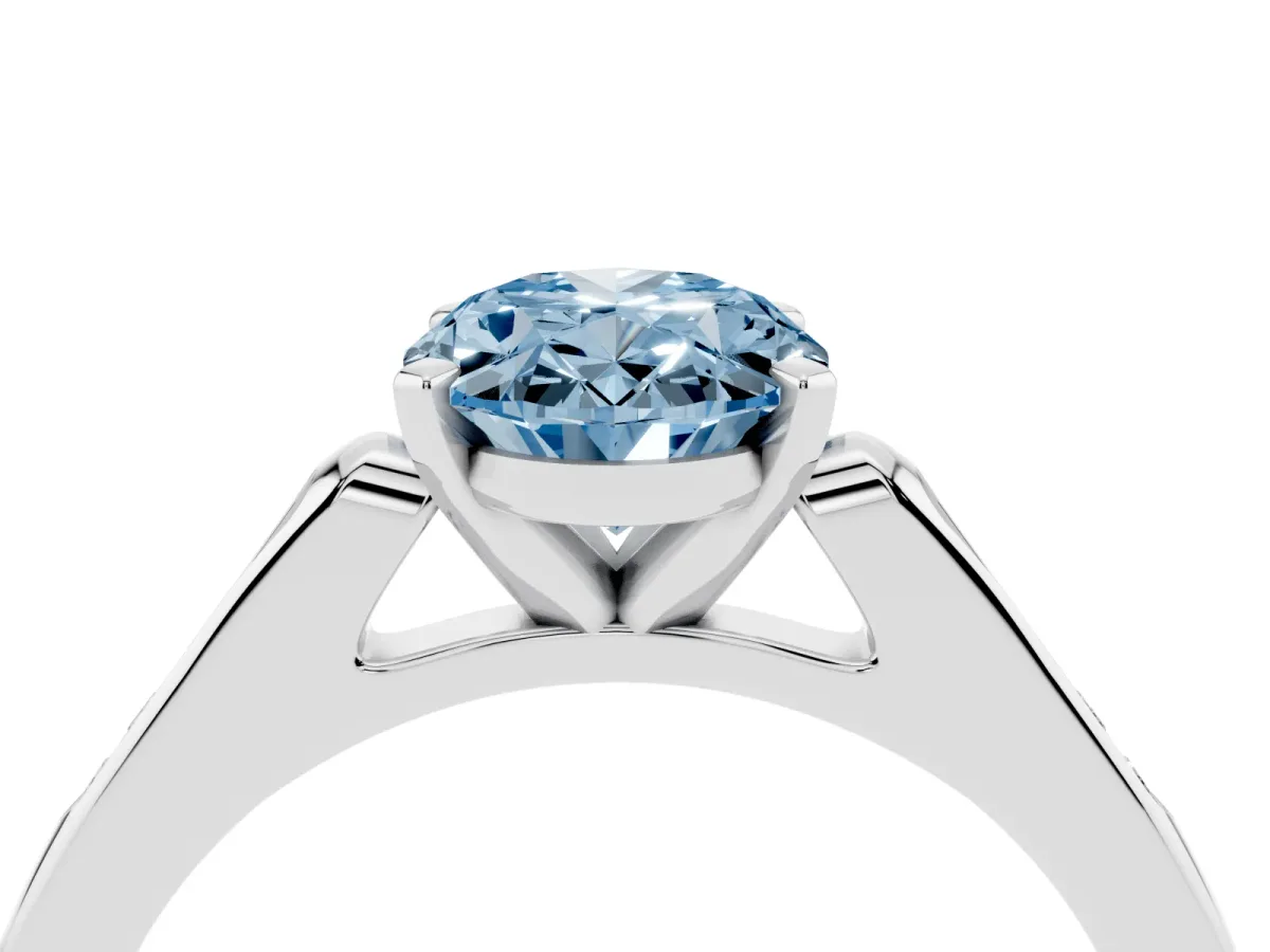 Fancy Blue Oval Cut Diamond Solitaire Ring with Channel Set Round Band and Prong Setting Silver
