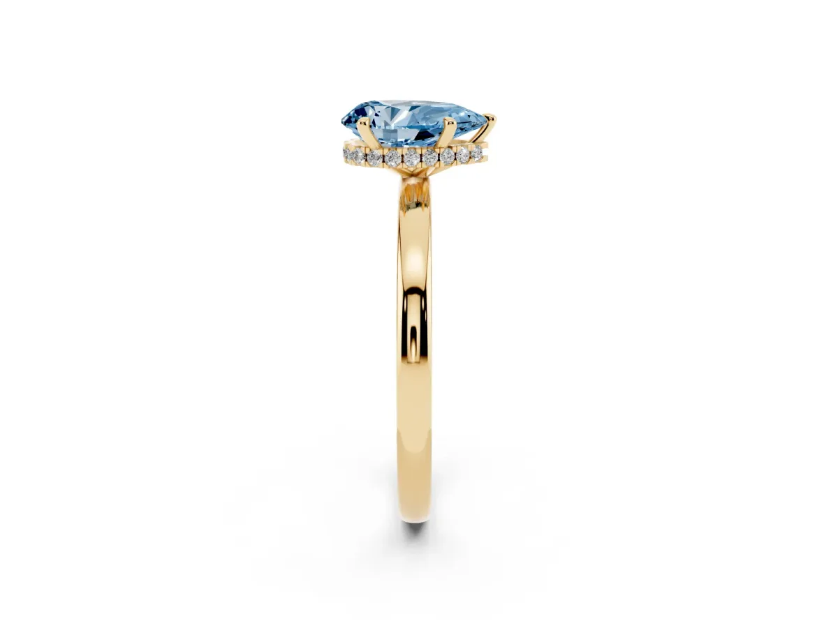 Fancy Blue Pear Cut Solitaire Engagement Ring with Cathedral Band and Four-Prong Setting Yellow gold