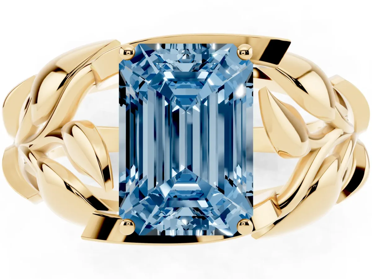 Fancy Blue Emerald Cut Diamond Leaf-Inspired Engagement Ring with Round Accents and Prong Setting Yellow gold