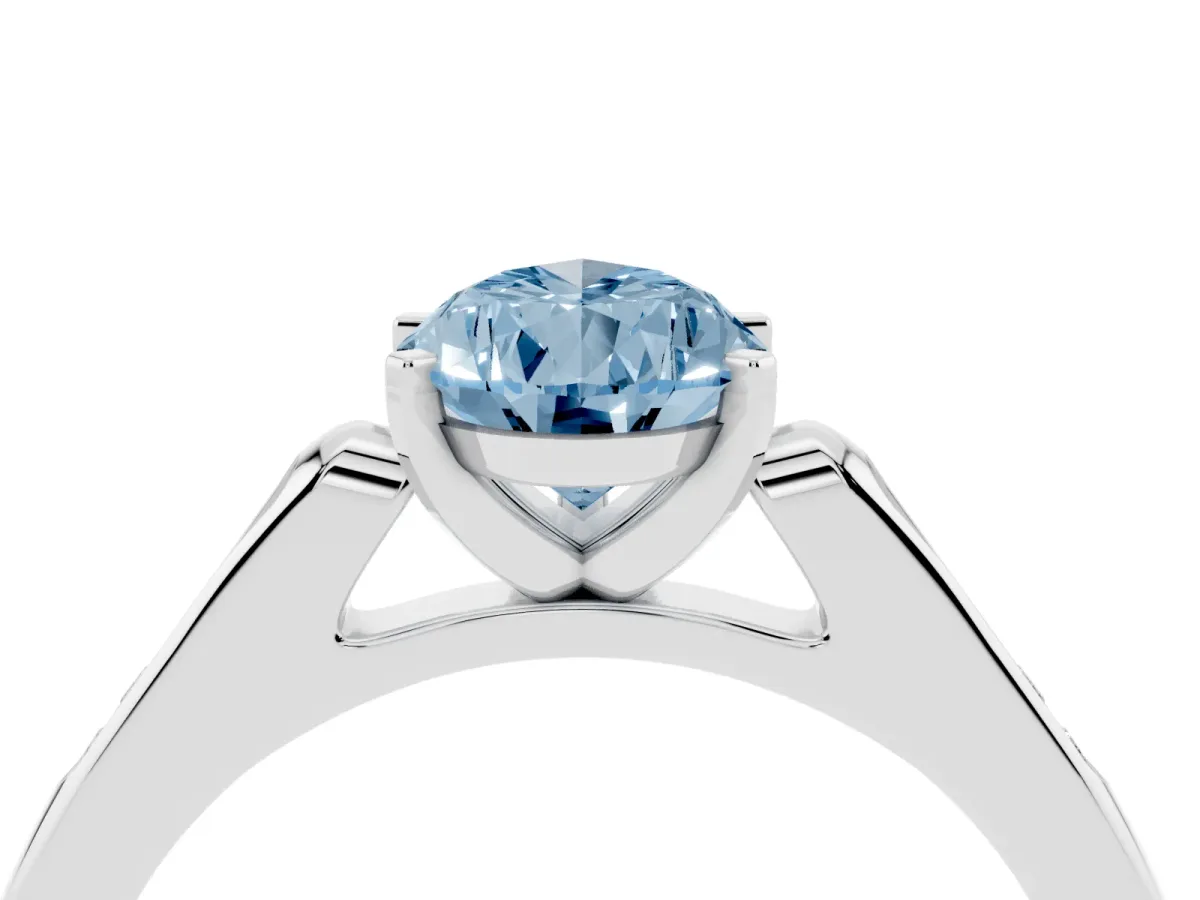 Fancy Blue Pear Cut Diamond Solitaire Ring with Channel Set Round Band and Prong Setting Silver