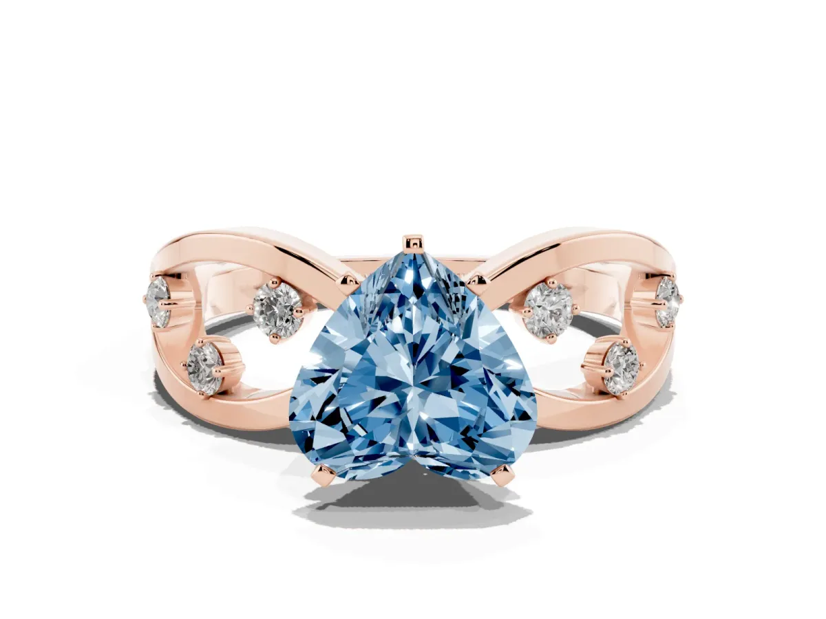 Fancy Blue Heart Cut Cut Solitaire Diamond with Side Stones on Criss-Cross Band and Four-Prong Setting Rose gold