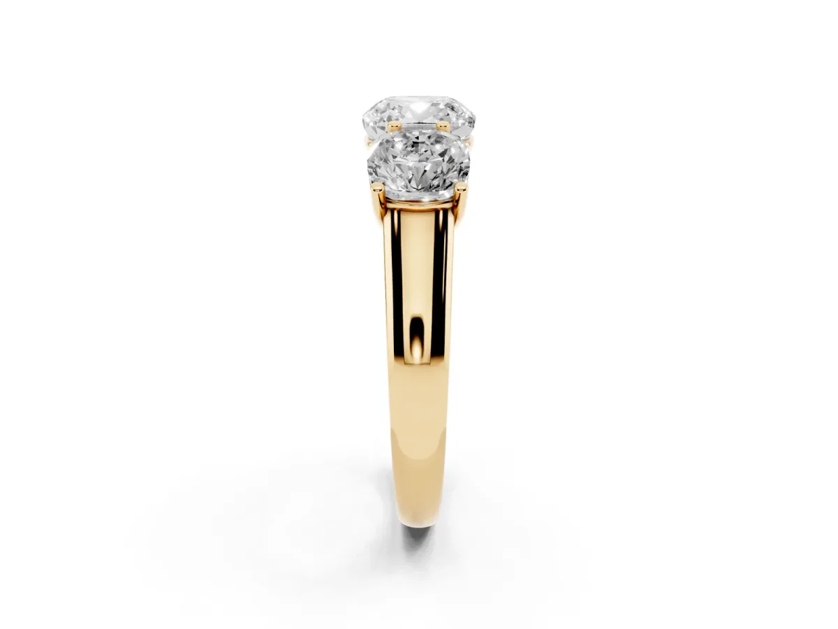 Cushion Cut Three-Stone Diamond Ring with Prong Setting on a Classic Band Yellow gold