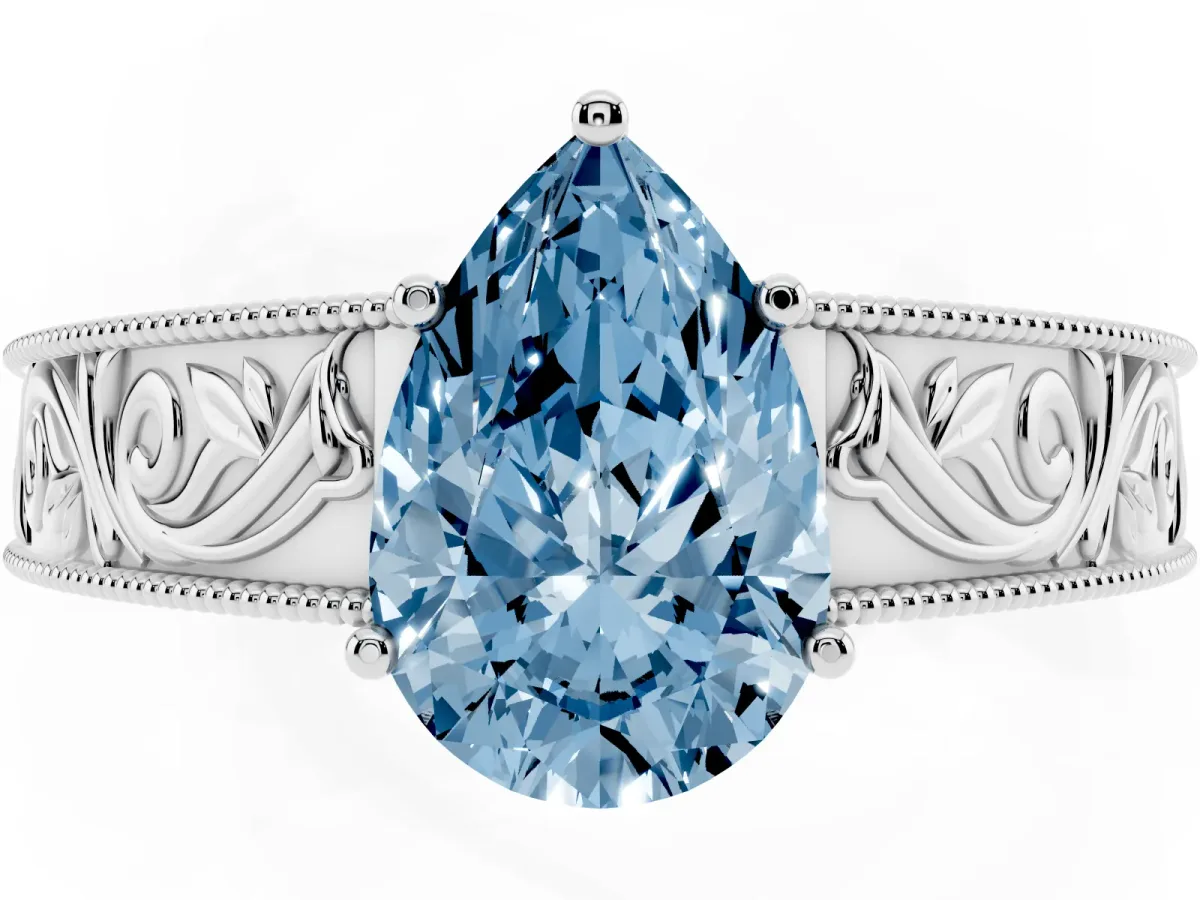 Fancy Blue Pear Cut Diamond Solitaire Ring with Engraved Band and Four-Prong Setting White gold
