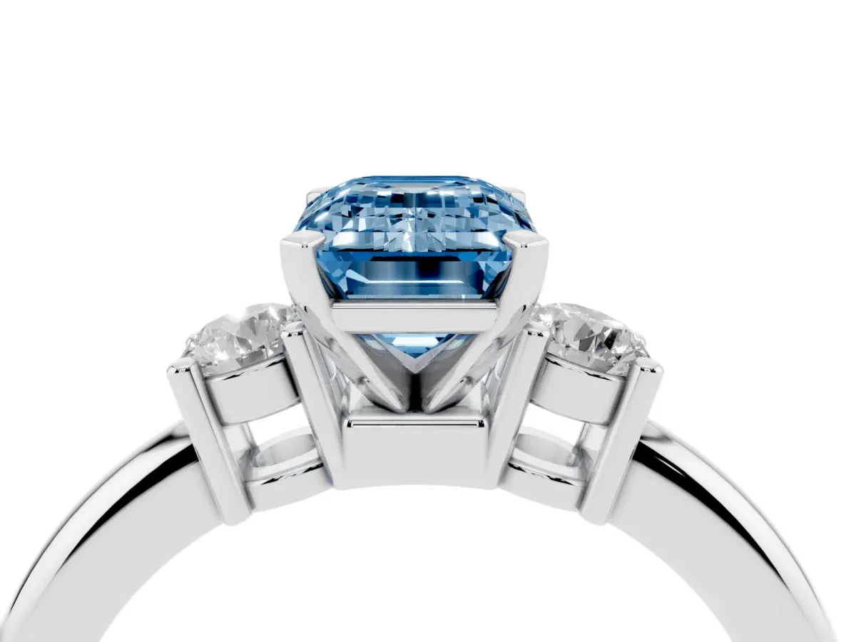 Fancy Blue Three-Stone Emerald Cut Cut Diamond Solitaire with Prong Setting and Classic Band Silver