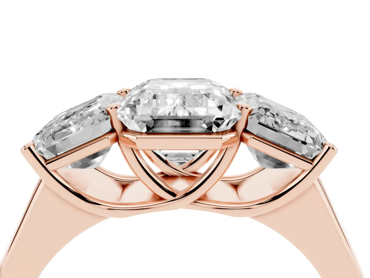 Emerald Cut Three-Stone Diamond Ring with Prong Setting on a Classic Band Rose gold