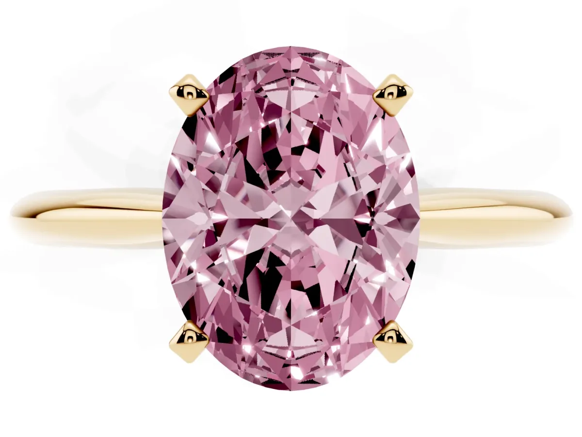 Fancy Pink Oval Cut Cut Solitaire Ring with Four-Prong Setting on a Classic Band Yellow gold