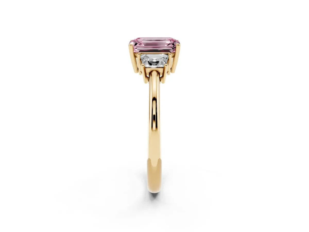 Fancy Pink Emerald Cut Diamond Three-Stone Ring with Trapezoid Side Stones and Prong Setting Yellow gold
