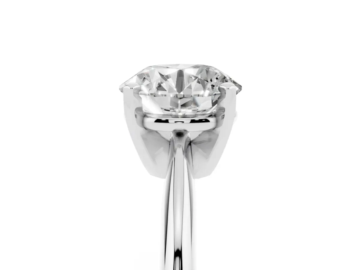 Round Cut Cut Solitaire Ring with Four-Prong Setting on a Classic Band Silver