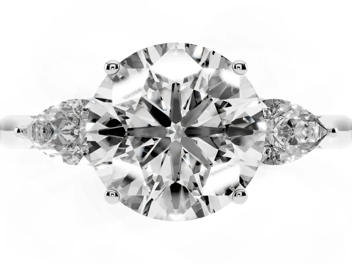 Round Cut Diamond Three-Stone Ring with Pear Side Stones and Prong Setting Platinum