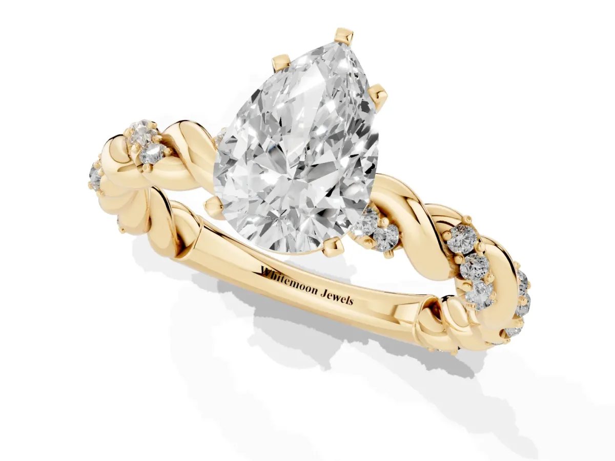 Pear Cut Diamond Solitaire Ring with Twisted Band and Pavé Accents Yellow gold