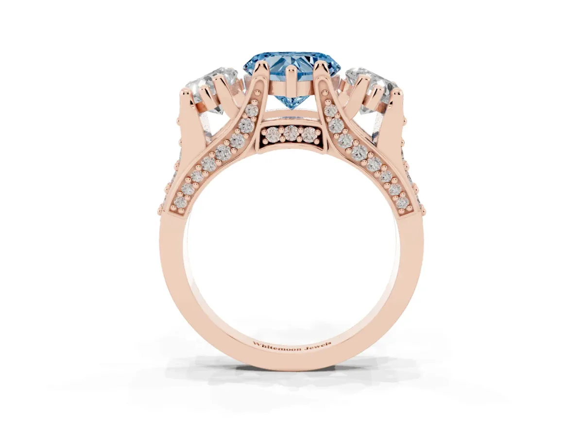Fancy Blue Heart Cut Diamond Three-Stone Ring with Channel Set Band and Four-Prong Setting Rose gold