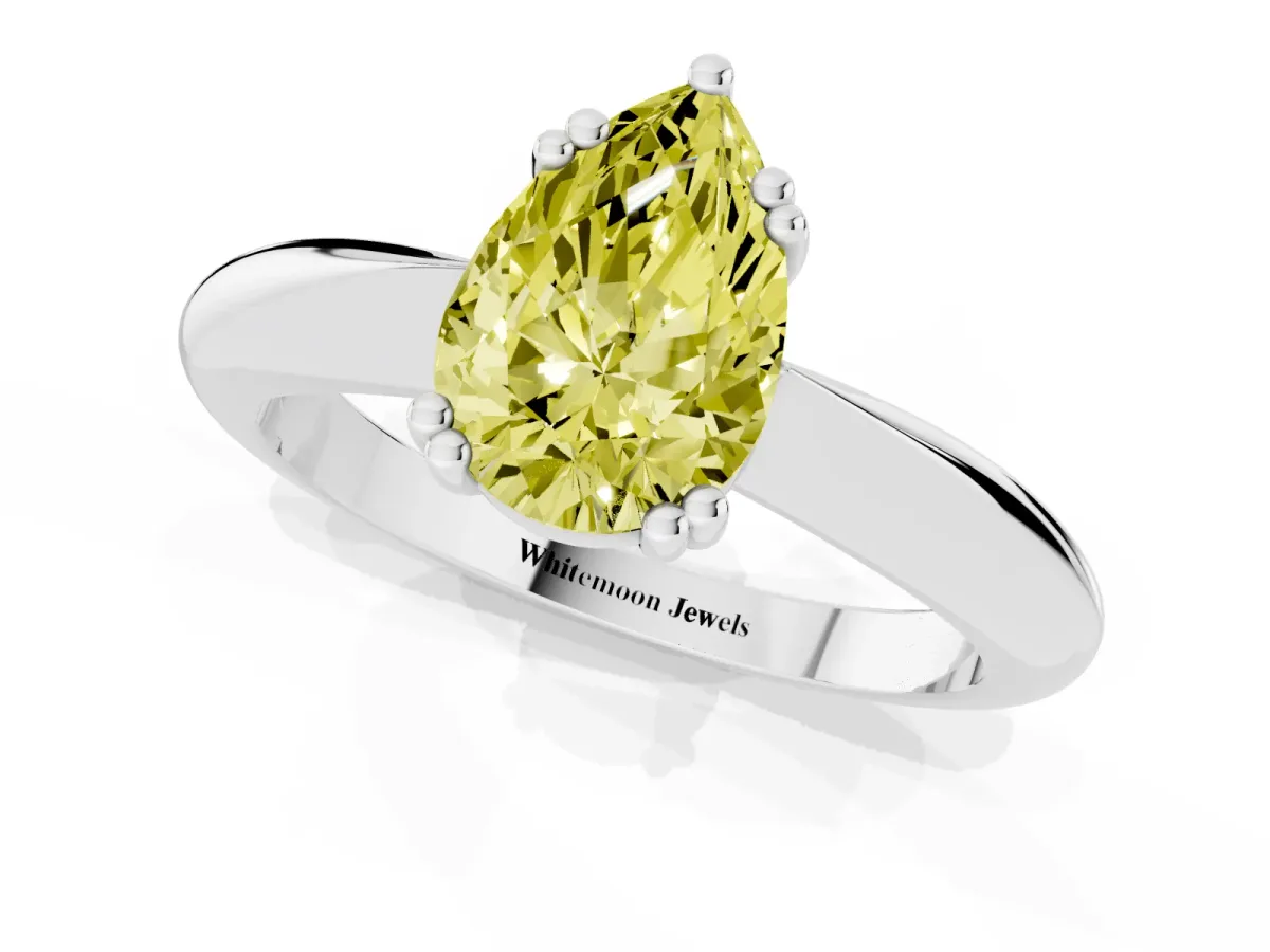 Fancy Yellow Pear Cut Cut Solitaire Engagement Ring with Tapered Band and Four-Prong Setting Silver