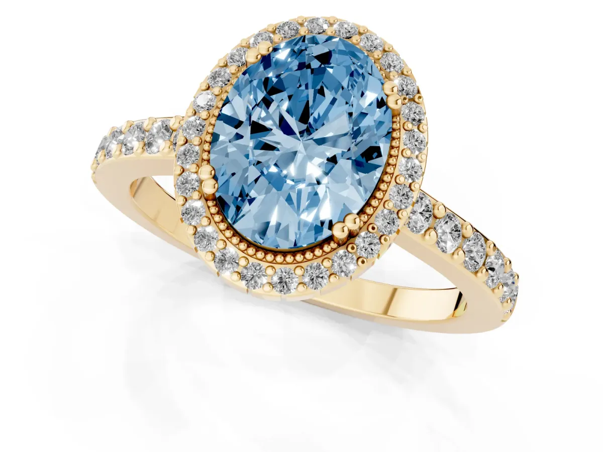Fancy Blue Oval Cut Cut Diamond Halo Engagement Ring with Milgrain Detail and Pavé Band Yellow gold