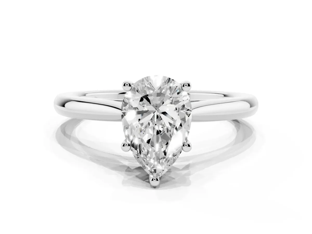 Pear Cut Cut Solitaire Ring with Cathedral Band and Four-Prong Setting Silver