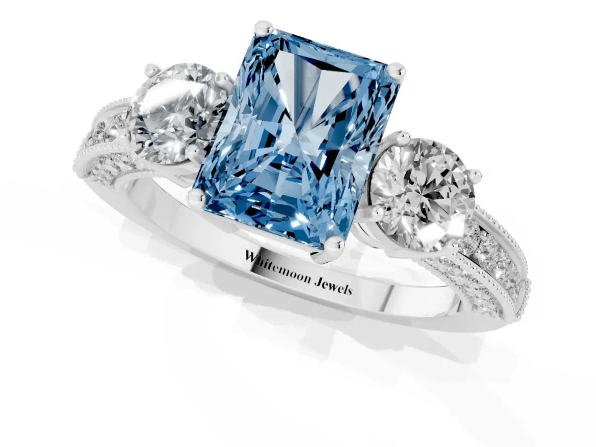 Fancy Blue Radiant Cut Three-Stone Diamond Ring with Pavé Band and Four-Prong Setting Silver