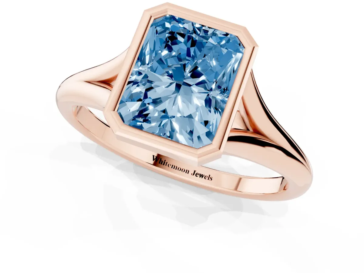 Fancy Blue Bezel Set Radiant Cut Cut Solitaire Ring with Tapered Band Rose gold