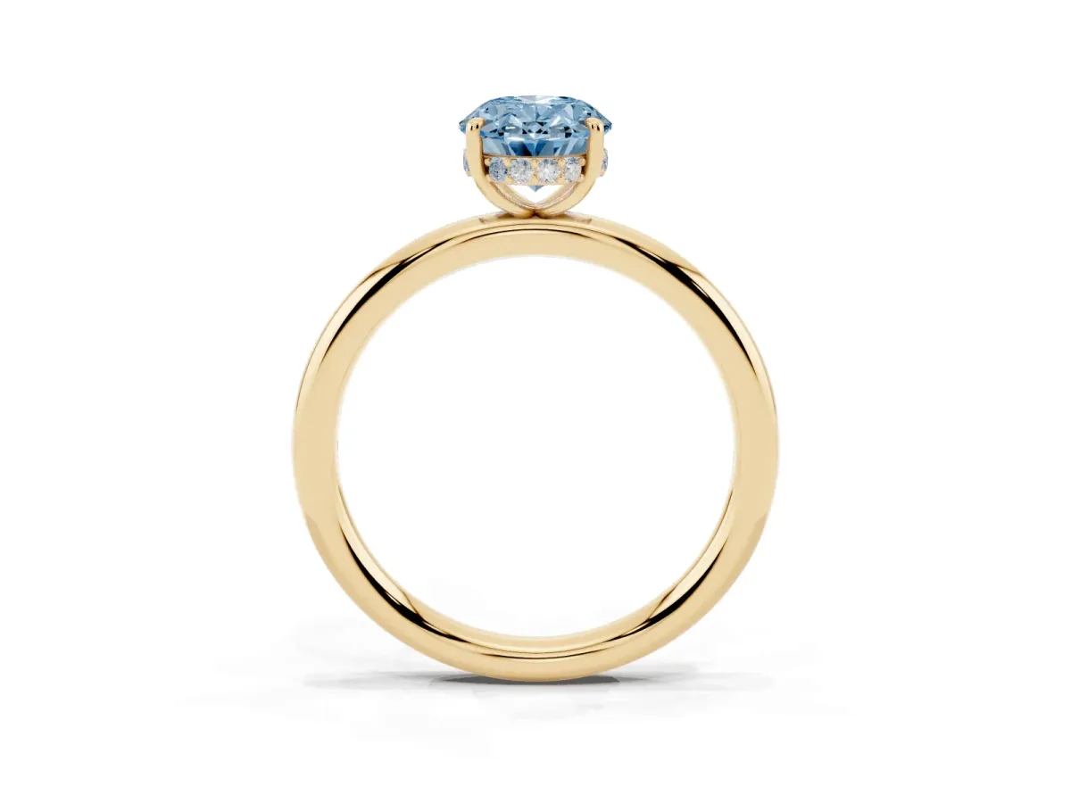 Fancy Blue Oval Cut Diamond Solitaire Ring with Thin Band and Four-Prong Setting Yellow gold