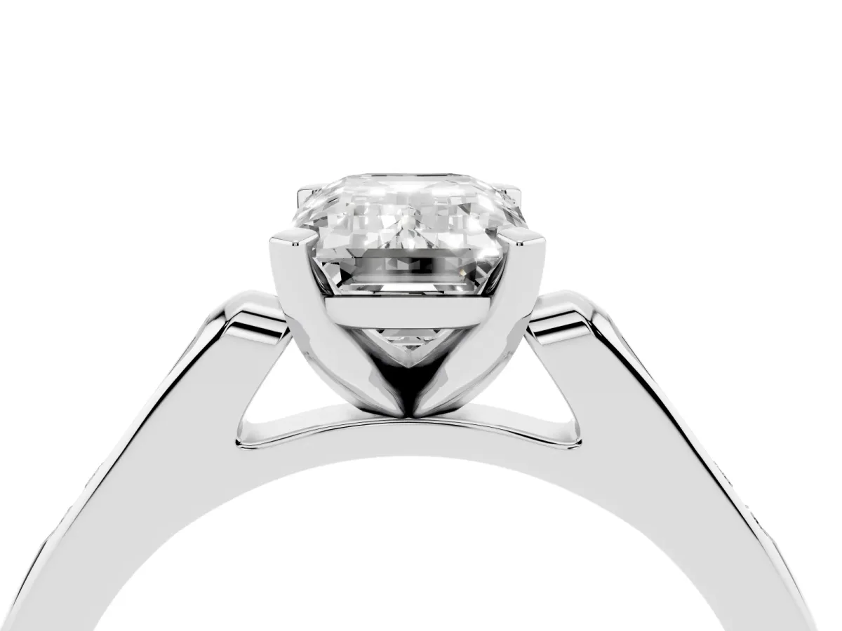 Emerald Cut Diamond Solitaire Ring with Channel Set Round Band and Prong Setting White gold