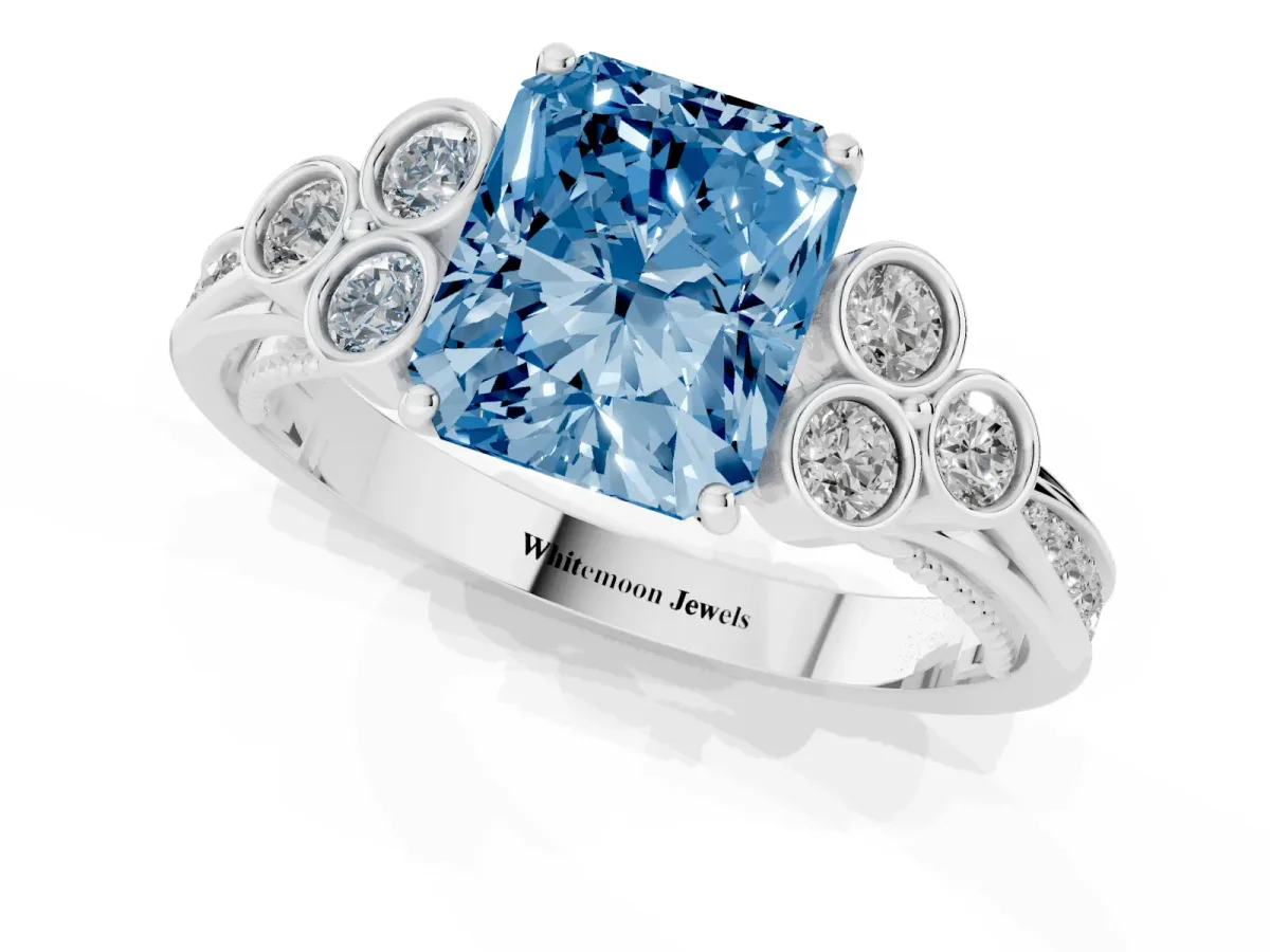 Fancy Blue Radiant Cut Cut Diamond Engagement Ring with Bezel Set Round Side Stones and Prong Setting Platinum