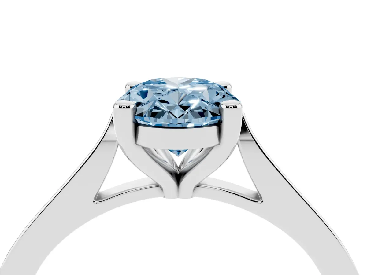 Fancy Blue Oval Cut Solitaire Diamond Ring with Four-Prong Setting and Tapered Band Platinum