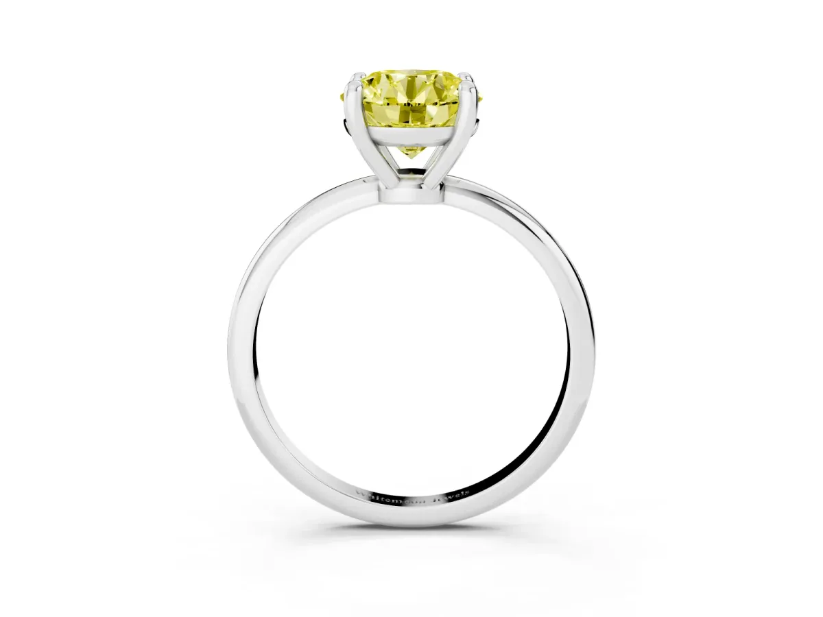 Fancy Yellow Round Cut Solitaire Diamond Ring with 4-Prong Setting on a Classic Band Silver