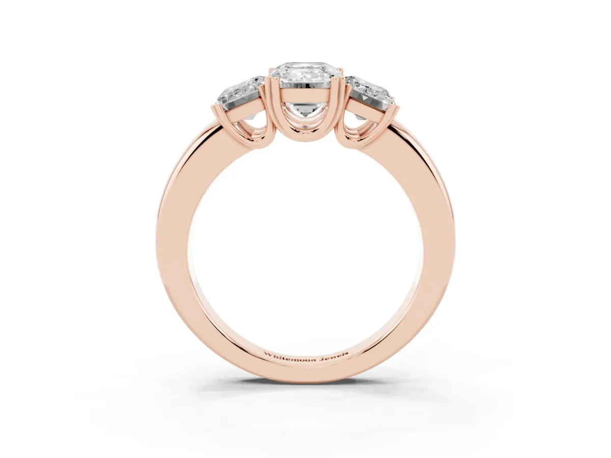 Three-Stone Emerald Cut Cut Diamond Ring with Channel Set Band and Four-Prong Setting Rose gold