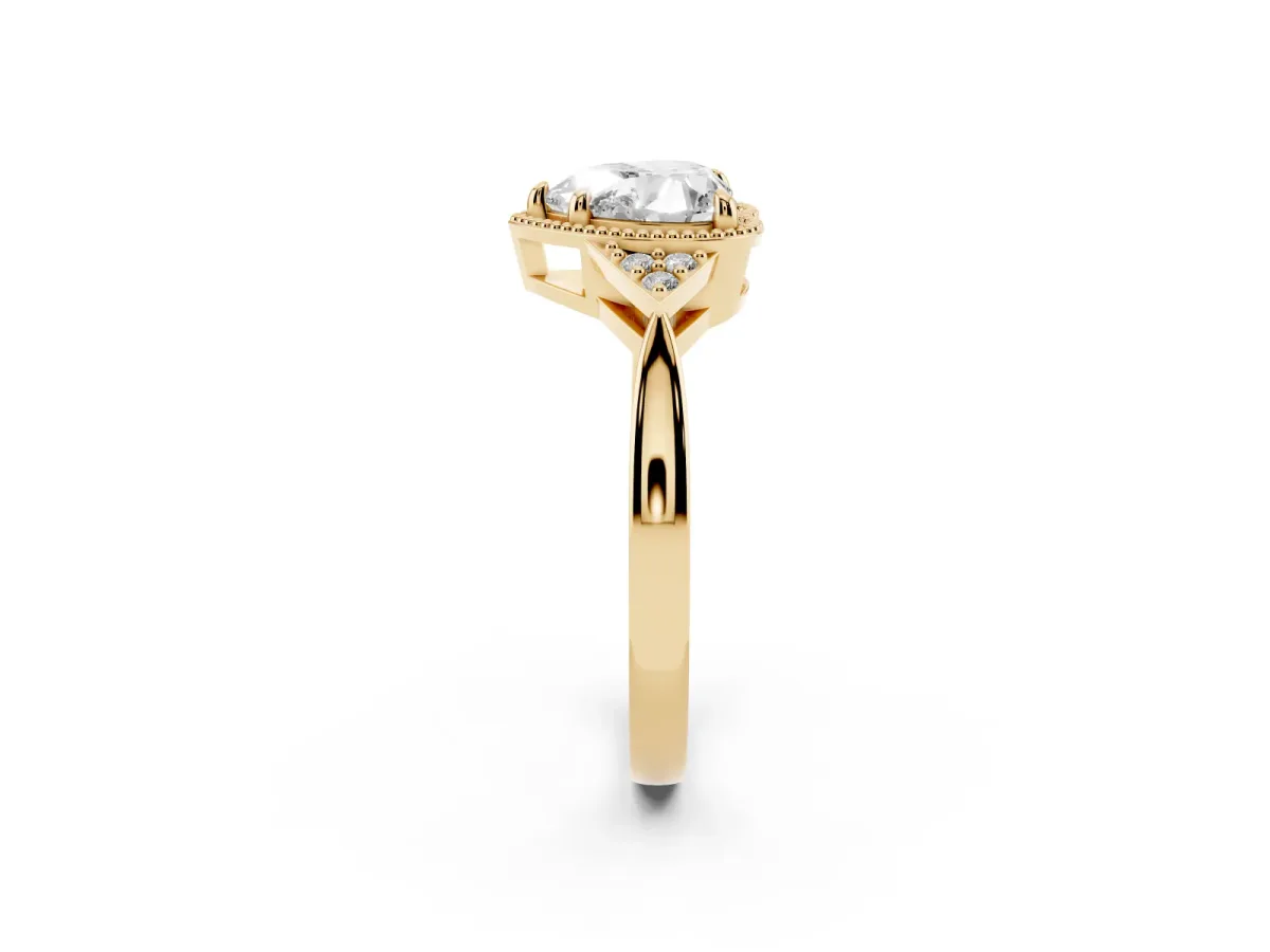 Milgrain Heart Cut Cut Diamond Ring with Tapered Pave Band and Four Prong Setting Yellow gold