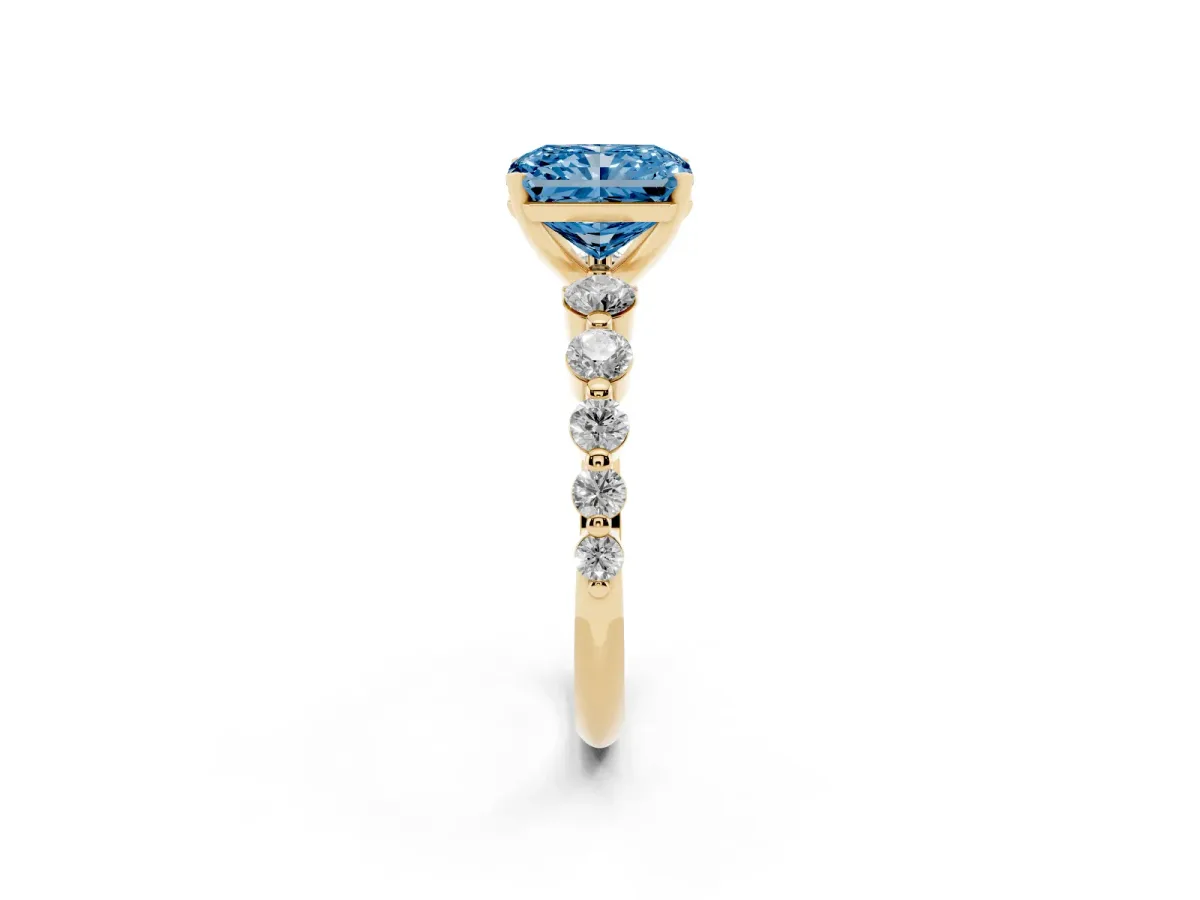 Fancy Blue Radiant Cut Solitaire Diamond Ring with Pave Band and Four-Prong Setting Yellow gold