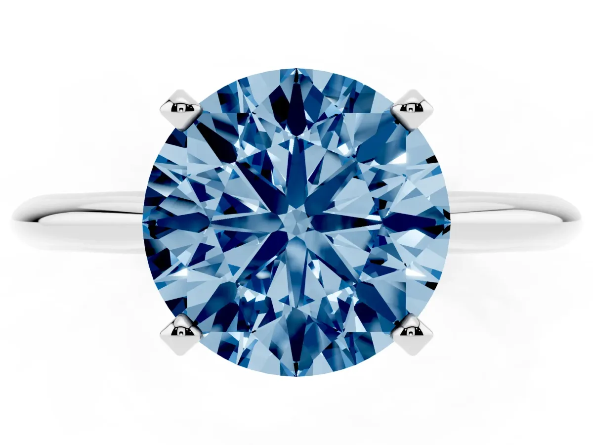Fancy Blue Round Cut Cut Solitaire Ring with Four-Prong Setting on a Classic Band Silver