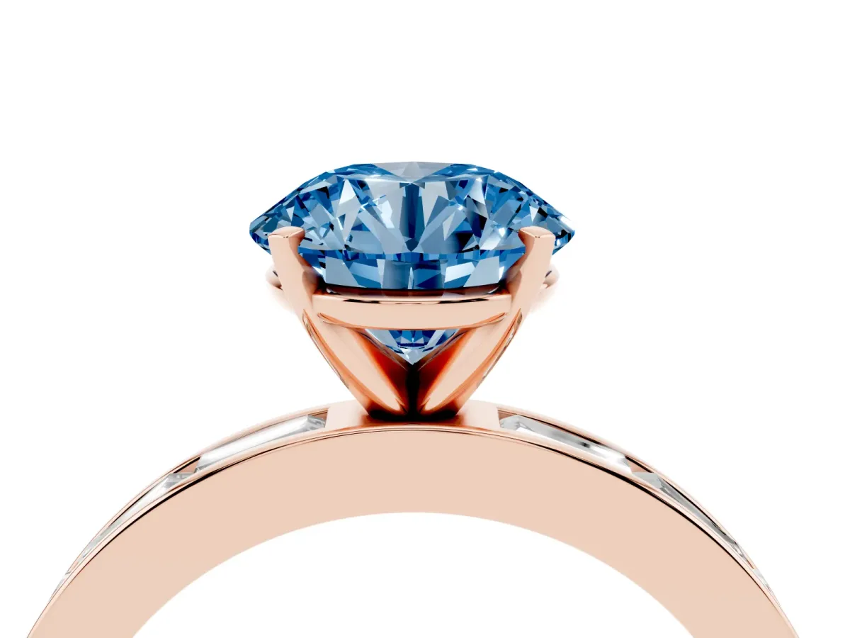 Fancy Blue Round Cut Solitaire Diamond Ring with Channel-Set Baguette Band and Four-Prong Setting Rose gold